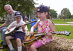Two kids with music instruments