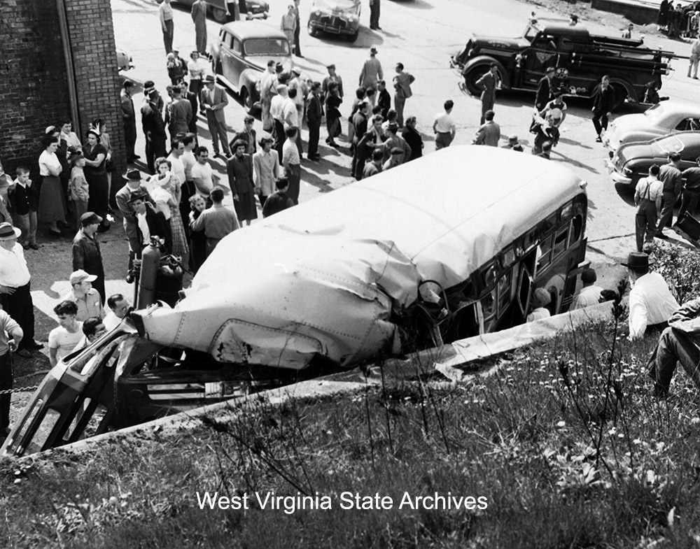 Fatal Pittsburgh and Weirton bus crash at a concrete wall in front of Starvaggi Garage on Pennsylvania Avenue, Weirton, April 29, 1951. Mil Radeka Collection, West Virginia State Archives (311006)