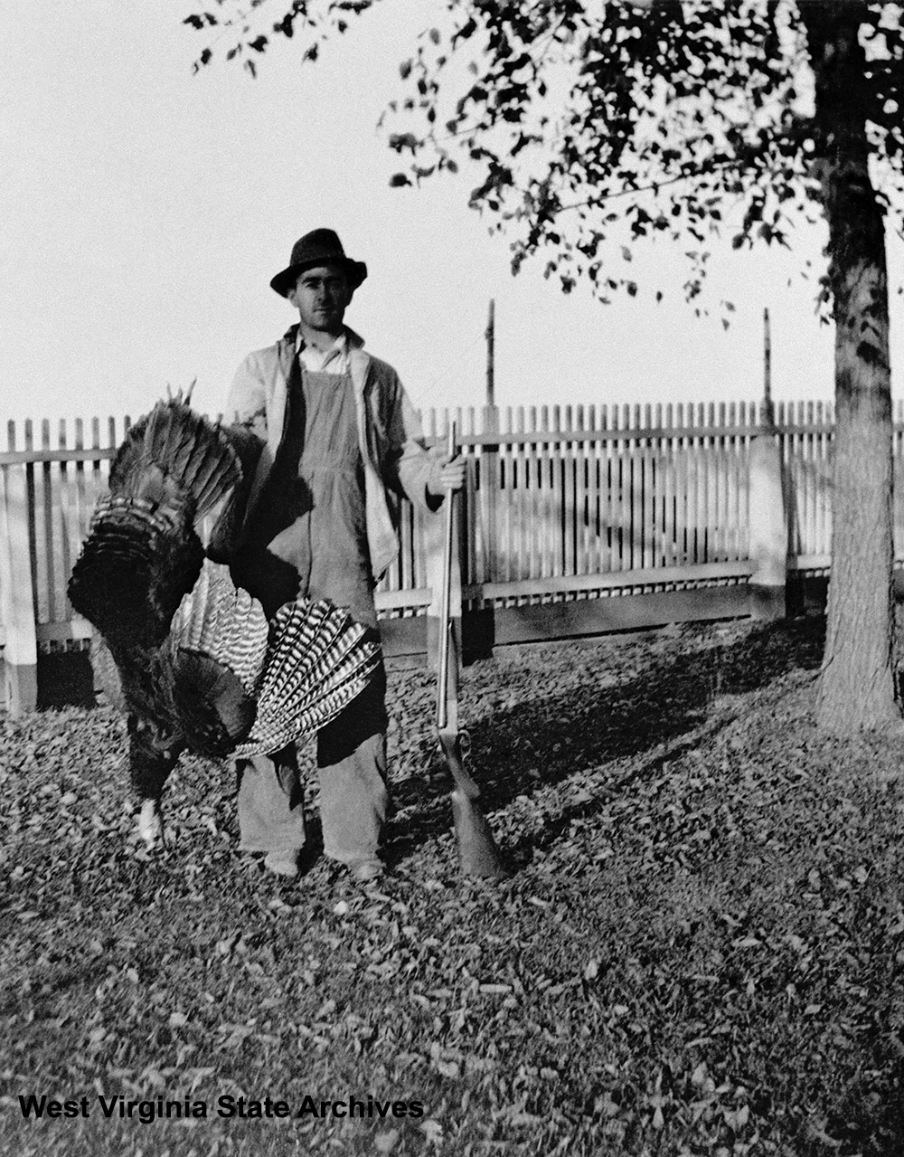 Dick Stimmel holding turkey he shot at Fort Hill Farm, Mineral County, n.d.  Mary Alice Hanah Collection, West Virginia State Archives (096902)