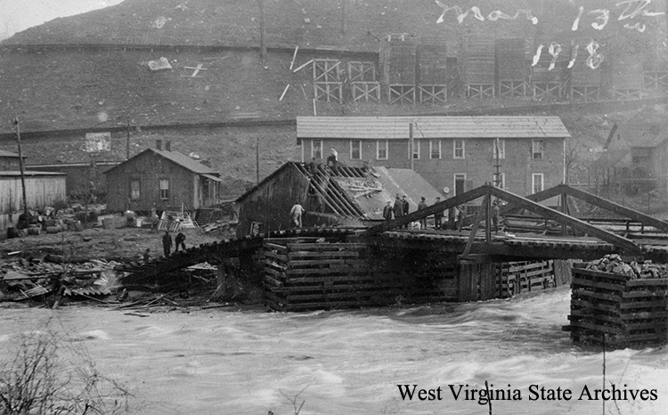 Flood damage to railroad bridge in Curtin, March 13, 1918. Manoka Woods Cox Collection, West Virginia State Archives (300915)