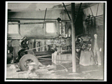 Interior view of the ice plant, Caretta store, mine Number 254. Man is standing at right. This picture is also found in the DeHaven Collection, Roll 1601 01.