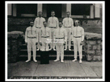 First Aid team standing on the steps to the clubhouse. Back row L-R: H. D. Sedlinger, D. H. McGraw, Captain H. T. Butler. Front row L-R: H. E. Wetzel, Sidney McDermott, James Stutson, Tom McDermott.