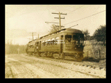 Fairmont and Clarksburg Traction Company car No. 210 on tracks in rural setting.