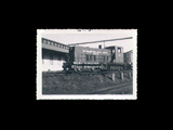 Meadow River Lumber Company Engine No. 8 in front of building. From small red photo album.