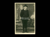 Postcard studio portrait full length view of unidentified man.
