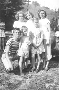 Charles Criss (in stripped
shirt) with his sister, Bonnie, nieces and nephews.