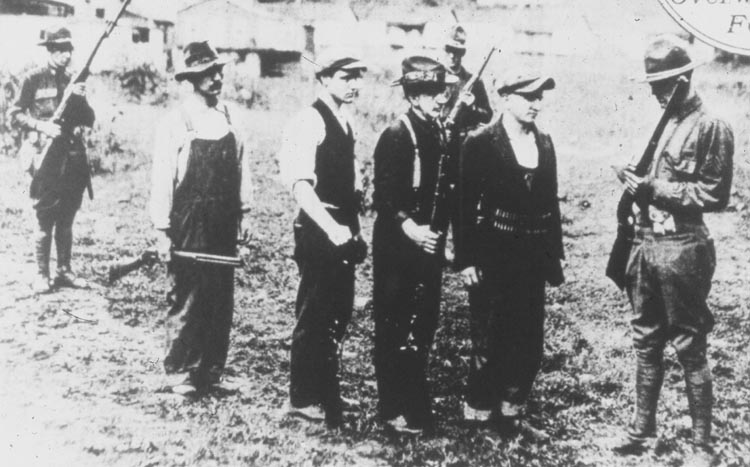 Miners turning in their weapons following the Battle of Blair Mountain