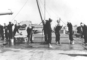 Sailors swabbing the deck of the ship, 1931