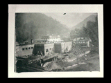 Rear of Coalwood store with gas tank in foreground. Clubhouse visible in background.