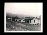 View across railroad tracks of Electro Metallurgical Company houses and the K&M station at Glen Ferris.