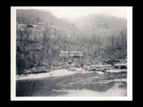 Gauley Junction power house site before the hydroelectric power construction on the New River. View from top of rock behind C&O signal tower. River and hillside. New- Kanawha Power Company, Hawks Nest - Gauley Junction Development No. 27.