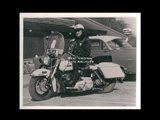 Policeman Paul Eddy on motorcycle.