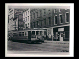 Streetcar No. 54, Wheeling-Warwood Trolley Line, on (Main?) street. Signs include Caldabaugh Glass and Mirror Company, Mader Furniture, The Palace, American Plate Window Glass Company.