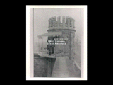 View of Tower Number 2 at the state penitentiary at Moundsville with guard standing with rifle.