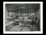 Interior view of Ohio Valley Hospital, showing the solarium with tables and chairs.