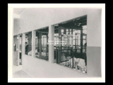 Interior view of Ohio Valley Hospital showing baby ward in the Pediatric Division, with view from hall of hospital cribs.