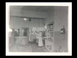 Interior view of Ohio Valley Hospital showing the main diet kitchen with three women standing at a table and cooking utensils on cabinets.