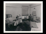Interior view of Ohio Valley Hospital showing a nurses double bedroom with beds, chairs, and other furniture.