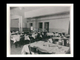 Interior view of Ohio Valley Hospital showing the nurses dining room with tables, chairs, and linen.