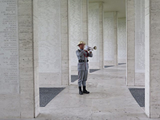 A bugler amidst the Walls of the Missing, Manila American Cemetery. Courtesy American Battle Monuments Commission