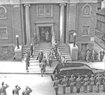 Honor Guard carrying casket into church