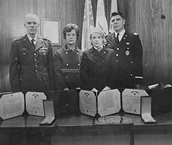 L-R: Larry's parents and sister with an Air National Guard officer as they receive his commendations. Courtesy Sharon Martin Orr