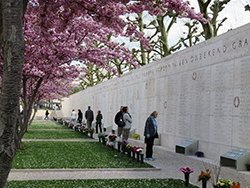 Visitors view the Wall of the Missing at the Netherlands American Cemetery. Courtesy American Battle Monuments Commission