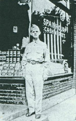 Charles Spainhour in front of store