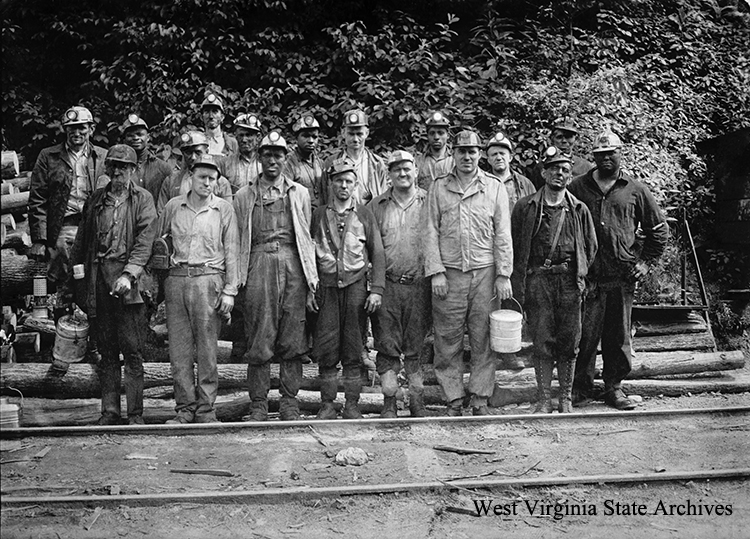 Record-setting crew at Island Creek # 1 mine, Holden, 1945. They loaded 216 cars with twelve-hundred tons of coal in eight hours using a 11-BU Joy coal cutter. Jarrel A. Perry Collection, West Virginia State Archives (332103)