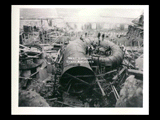 Power house site during the hydroelectric power construction on the New River. View of steel scroll case for unit No. 3 looking toward river. This casing is 90 percent completed. Men working. New-Kanawha Power Company, Hawks Nest - Gauley Junction Development No. 232.