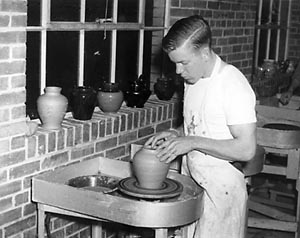 Student at potter's wheel