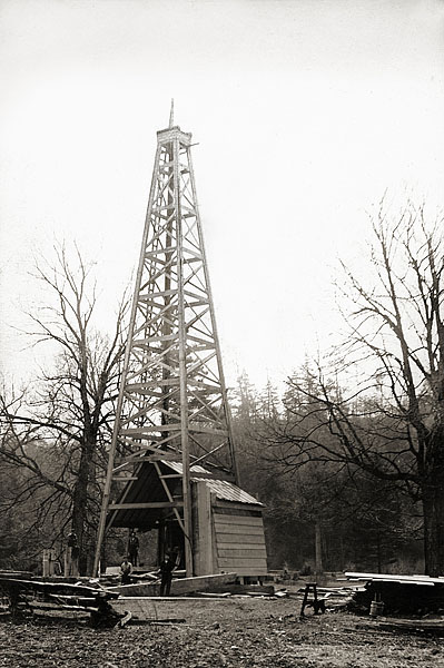 A oil derrick under construction by Ulysses S. Grant “Lyss” Dye, and crew, near Elkins, in about 1910