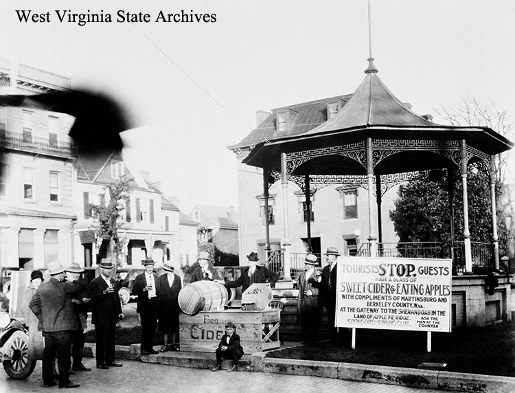 Bandstand offering free apple cider to tourists and guests in Martinsburg, circa 1928. Berkeley County Landmarks Commission Collection, West Virginia State Archives (083609)