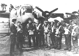 Sgt. Kenneth C. Amick, fourth from left [without hat], flight engineer/tail gunner, 44th Bombardment Group at Shipdham, England, 1945. <i>Charleston Gazette</i> photo, 25 July 2002, used with permission