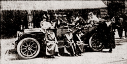 Suffragists selling Wheeling newspaper from automobile