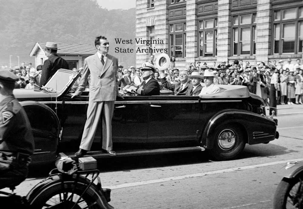 President Franklin D. Roosevelt in parade car with West Virginia Governor Homer Holt and Senator Matthew Neely, Charleston, September 3, 1940