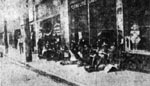 Logan men waiting on the street to be taken into action. Huntington Advertiser, 4 September 1921