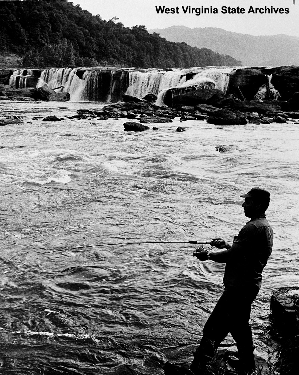 Jerry Deluca fishing on New River at Sandstone Falls, n.d. Arnout Hyde Jr., photographer. Martinsburg Chamber of Commerce Collection, West Virginia State Archives (114205)