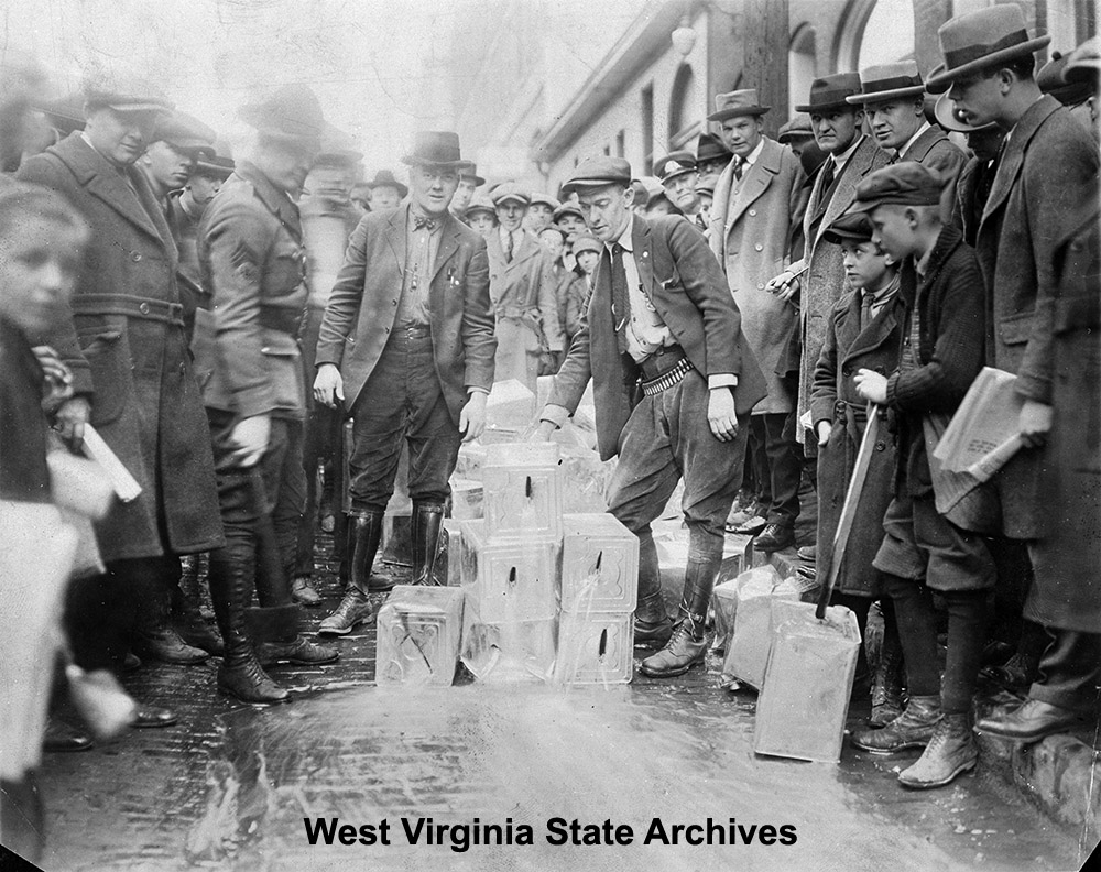 Dumping illegal liquor in streets, Morgantown, n.d. Olin Ruth Collection, West Virginia State Archives (128111)