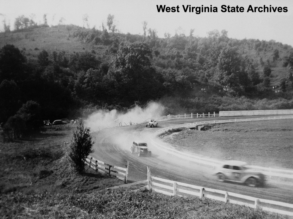 Automobile racing action in the turn at Pennsboro Speedway, n.d. Betty Leavengood Collection, West Virginia State Archives (326415)