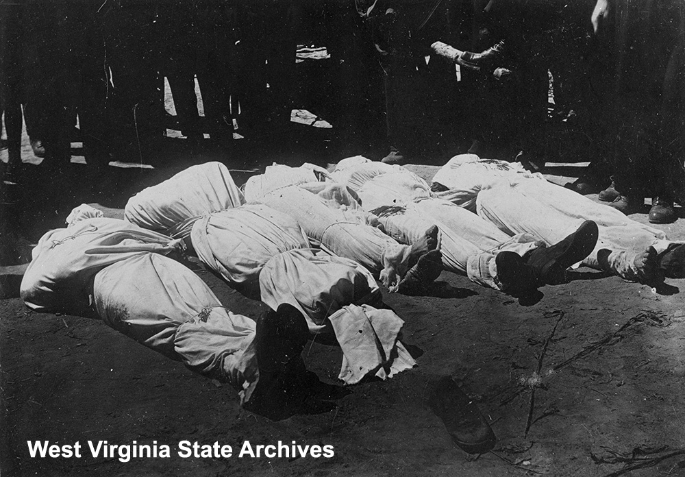 Dead perpetrators, wrapped, from Glen Alum Coal Company robbery, August 1914. Kenneth King Collection, West Virginia State Archives (344008)