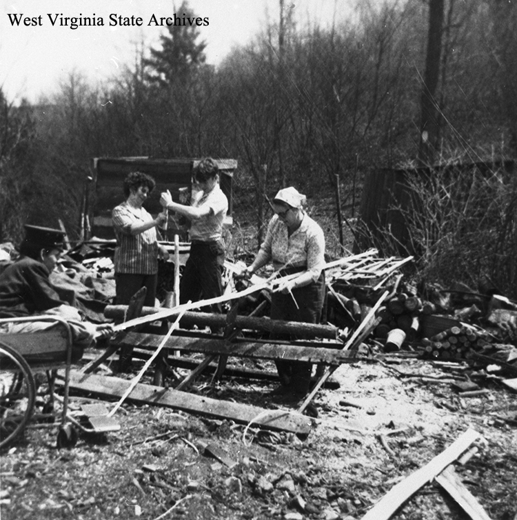 Dorothy Thompson (right) splitting white oak for baskets. Others include B.D. Thompson and Candis (?) Laird, 1967. Dorothy Thompson Collection, West Virginia State Archives (306509)
