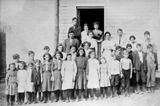 Arden School. Moatsville, circa 1912. 
<p>
First row: Cordie Weaver, ?, Ida Murphy, Burton Murphy, Oda and Ada Murphy (twins), Mildred Murphy, Wilma Murphy, Savannah Duckworth, Bertha McVicker, Aldine Murphy, John McVicker, Oren Murphy, Bill Laulis. Second row: Dirl Murphy, John Laulis, Bernie (Slim) Murphy, Lottie Murphy, Delphie Weaver, Rose Murphy, Harvey Morrell, Leo Murphy. Third row: Wilkie Murphy, teacher, ?, ?, ?, ?, ?, ?, ?, ?, Genvra Gall, Elsie Murphy, Irston Murphy, Nellie Weaver, Henson Murphy. In doorway: Darl Robinson, Haley Laulis, Mae McVicker.