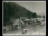 Construction of houses along Barranshe Creek, looking west. Automobile at bottom of picture. This picture is also found in the DeHaven Collection, Roll 1610 09.