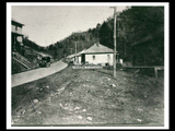 Homes along Tennessee Avenue, Caretta, mine Number 261. Automobile is parked on street. This picture is also found in the DeHaven Collection, Roll 1605 03.