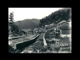 Unidentified coal town  with houses before sidewalks were constructed.