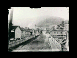 Street scene with miners homes in coal town. United States Steel. Gary No. 3 according to information provided by database user, who notes view is toward Methodist church.