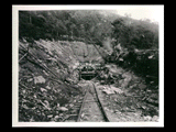 Adit during the hydroelectric power construction on the New River. View taken slightly off centerline of adit showing formwork being erected for placing concrete in the walls and roof of the adit section. Workers at opening. New-Kanawha Power Company, Hawks Nest - Gauley Junction Development No. 410.