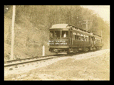 Fairmont and Clarksburg Traction Company electric train No. 210 on tracks in rural setting.