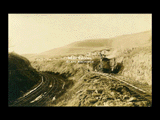 Construction of Wolf Summit extension. Houses, steam shovel, railroad tracks.